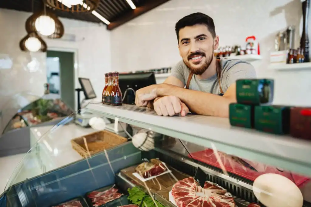 portrait of confident young salesman standing in b 2023 11 27 05 35 33 utc 1